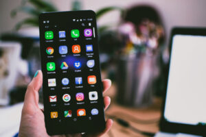 Person holding up an Android phone.