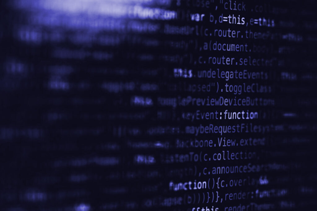 Close-up and out of focus image of code.