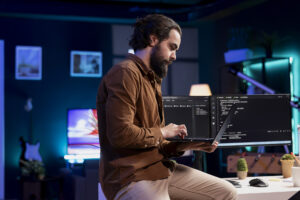 Man on computer in his office.