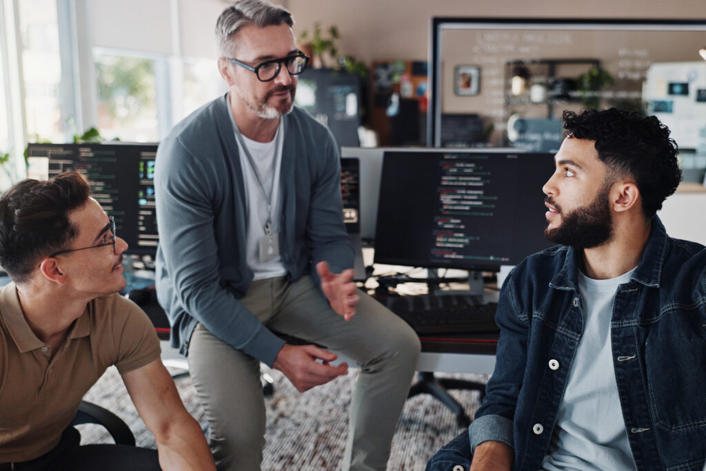 Programmers working together at the office.